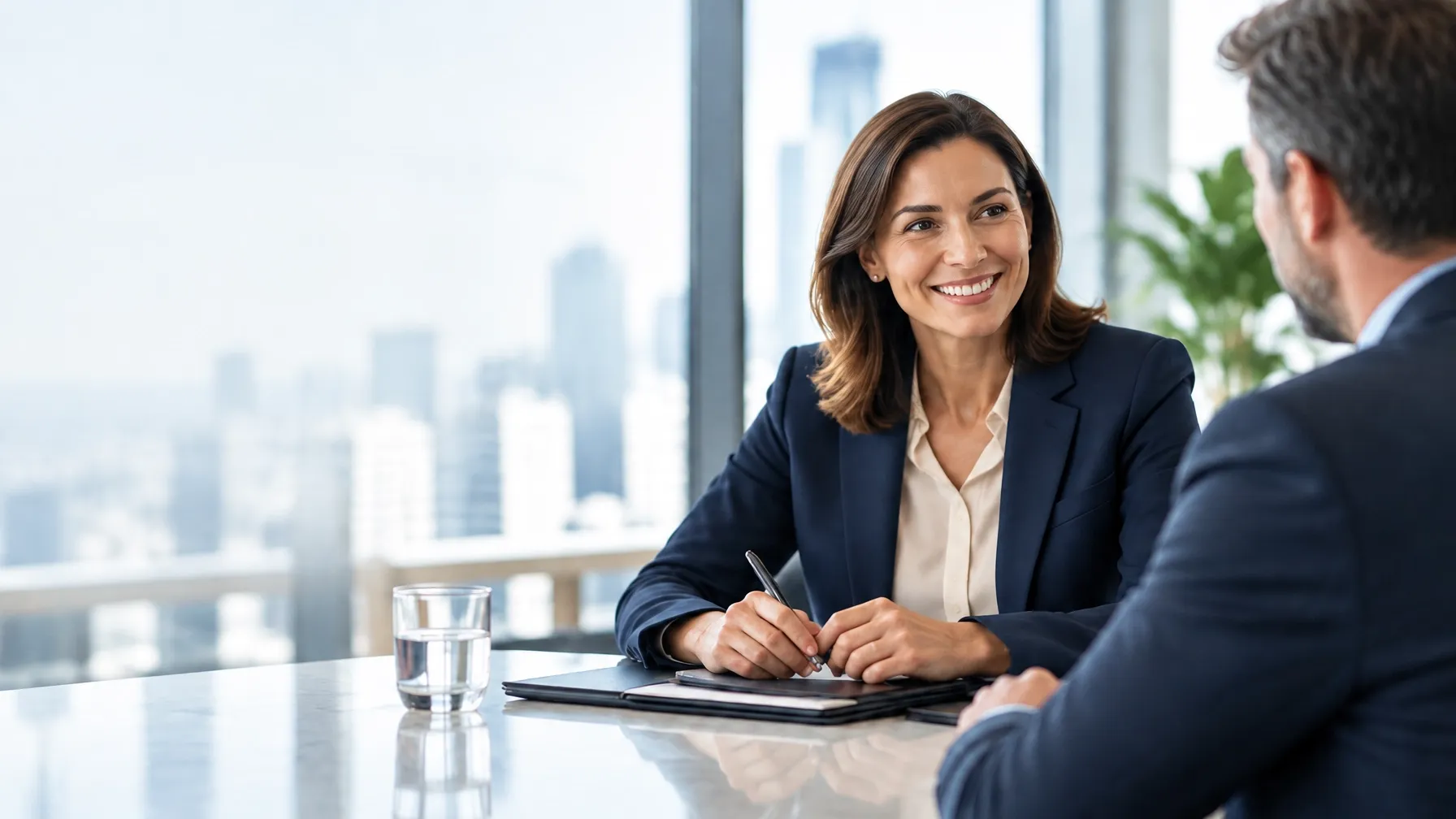 Recruiter meeting with an executive in a bright modern office